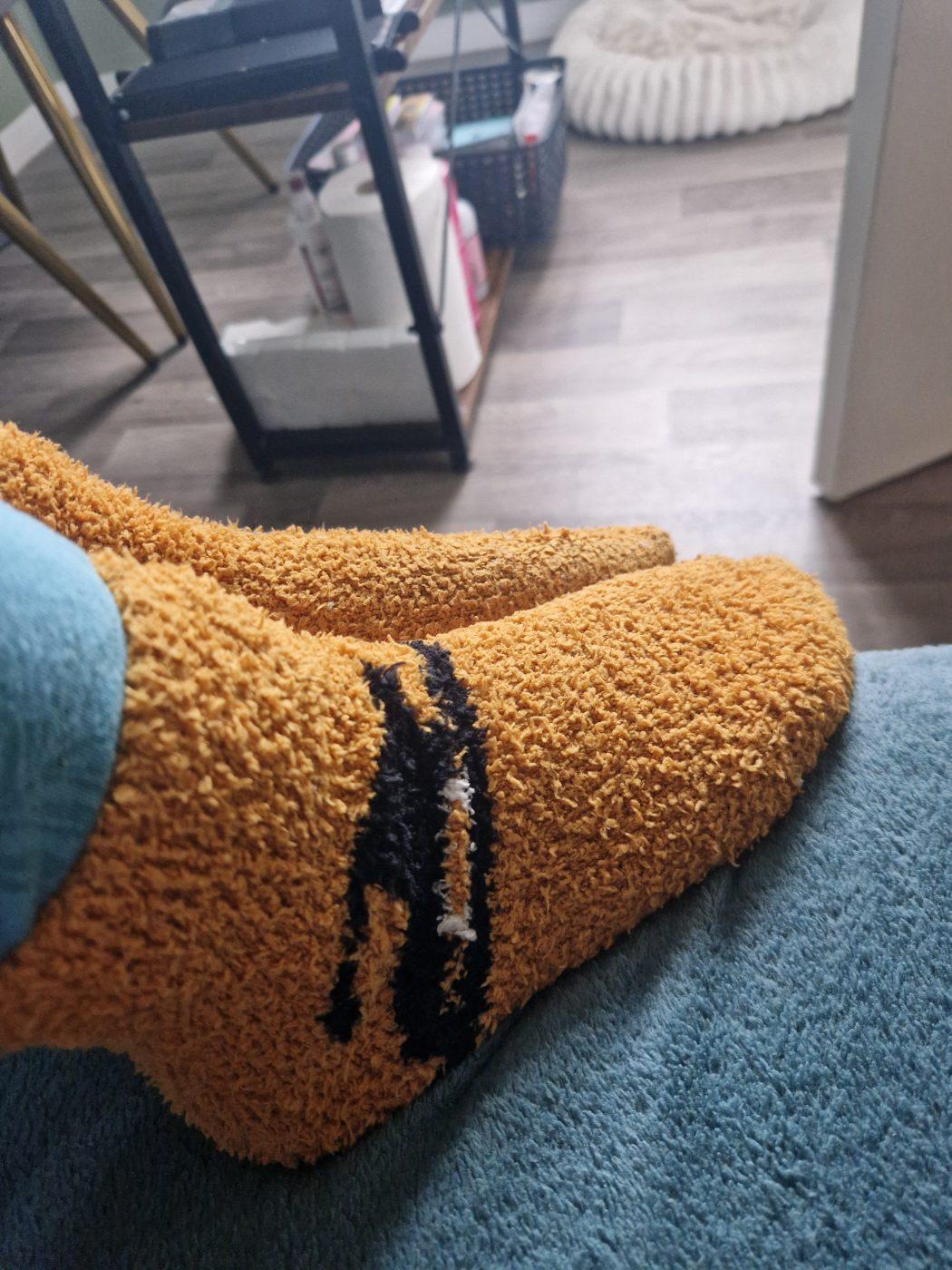 Fluffy cleaning socks worn by Berty, a verified UK seller